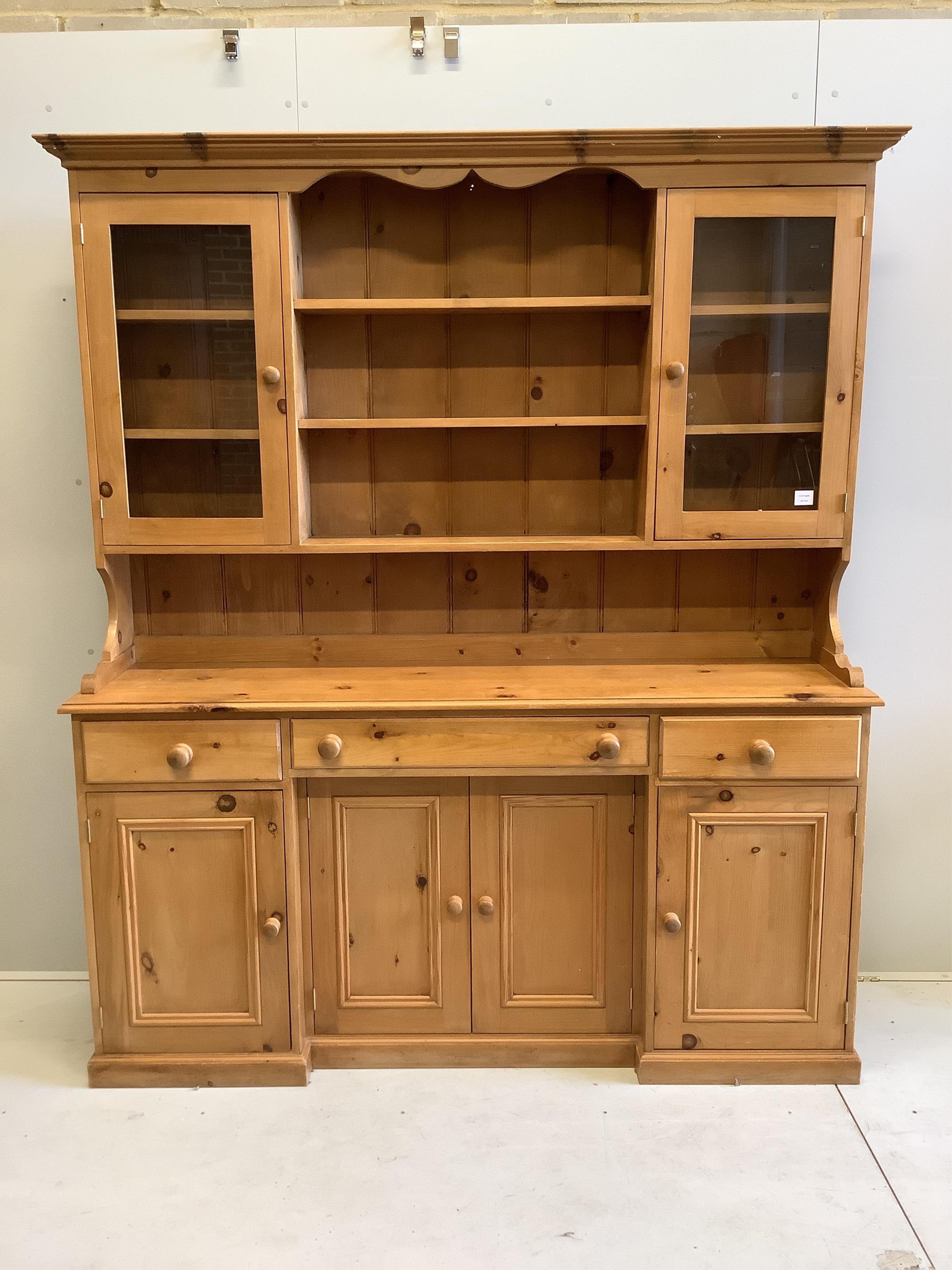 A Victorian style plain pine dresser, width 172cm, depth 44cm, height 203cm. Condition - fair